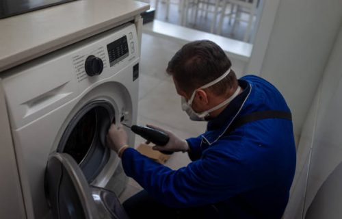 Washing machine repair technician during pandemic